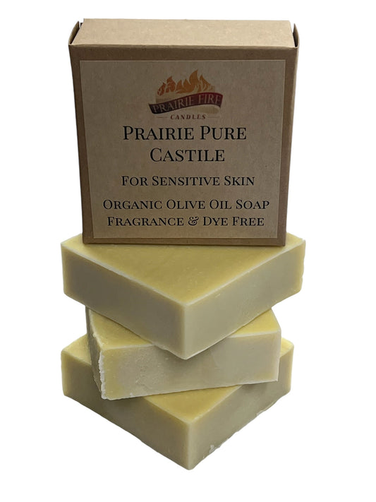 Three bars of organic olive oil Castile soap stacked with a labeled box for sensitive skin