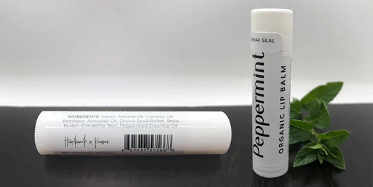 Peppermint organic lip balm tubes with natural ingredients and fresh mint leaves