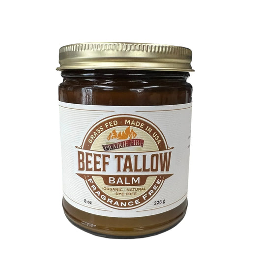 Jar of grass fed beef tallow balm with gold lid on white background