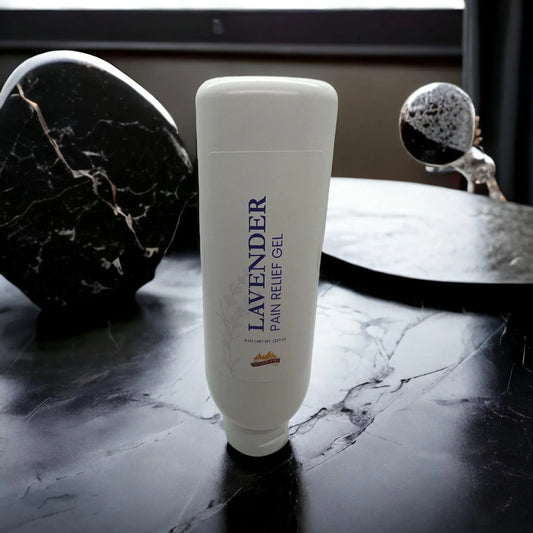 Lavender pain relief gel tube on a black marble surface, natural wellness product