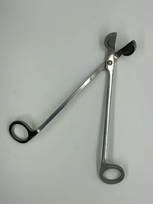 Stainless steel candle wick trimmer on a white background