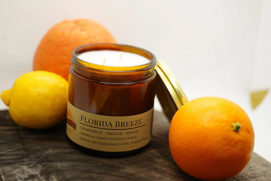 Florida Breeze soy wax candle in amber jar with grapefruit, lemon, and orange