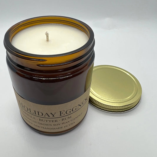Holiday Eggnog soy wax candle in amber jar with gold lid, vanilla butter rum scent