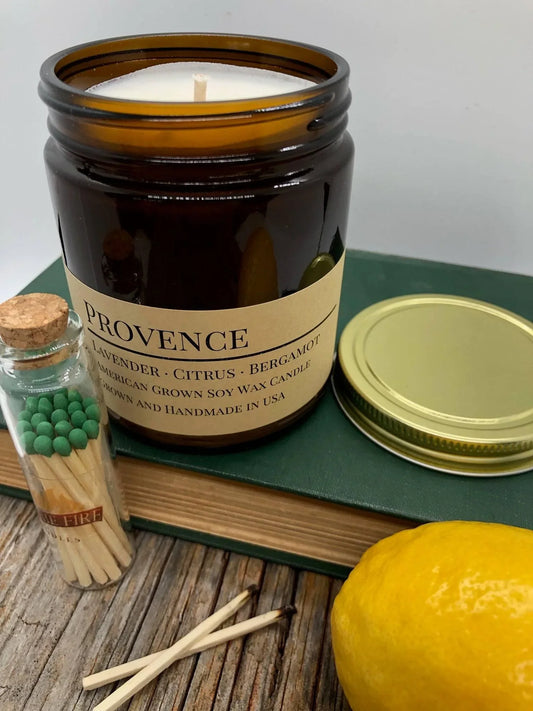 Provence lavender citrus bergamot soy wax candle in amber jar with matches and lemon
