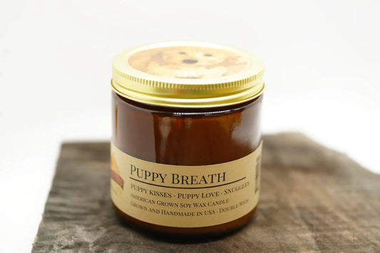 Amber apothecary jar with Puppy Breath soy wax candle, gold lid, and puppy image on top