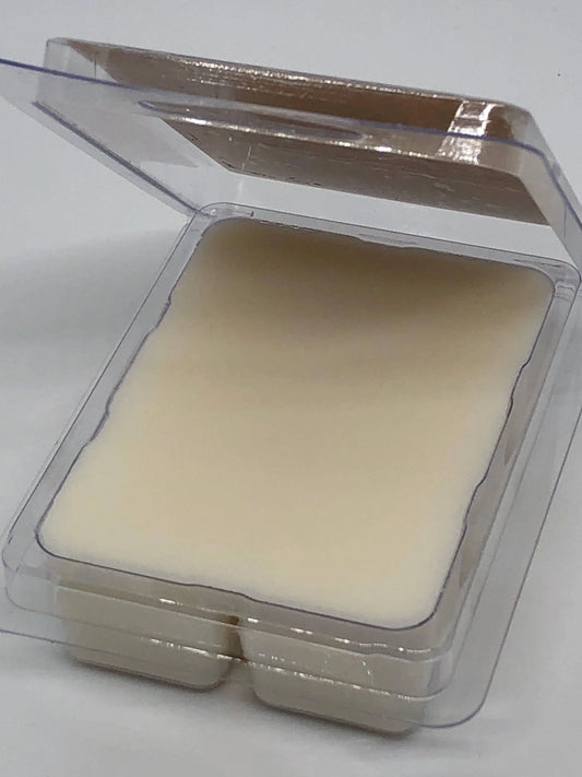 Soy wax melts in clear plastic clamshell container on a white background